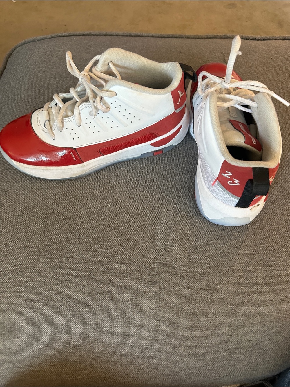 Boys Jordan’s White and Red Basketball Shoes